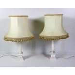 A pair of marble table pillar Lamps, with cream and gold frill decoration.