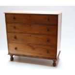 A 19th Century pine Chest, the plain top over four long drawers with circular wooden handles,