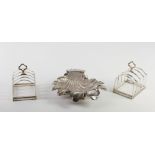 A matching pair of Birmingham silver Toast Racks, and an unusual shell shaped Butter Dish, London c.