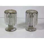 A pair of cutglass Lustre Candlesticks, 23cms (9") high.