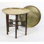 A 19th Century Moroccan brass decorated Tray on folding pierced decorated stand;