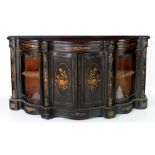 A large Victorian ebonised serpentine shaped inlaid and ormolu mounted Credenza,