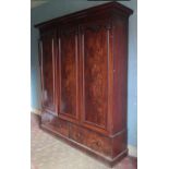 A good quality Victorian figured mahogany three door Wardrobe,