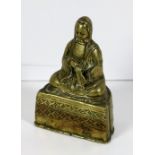 A 19th Century heavy bronze Model of a seated Buddha type Figure, in headdress,