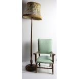 A wooden Lamp Standard, with floral shade, an oak framed upholstered Open Armchair,