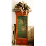 An Edwardian oak Gun Cabinet, leather gun cartridge, satchels and case,