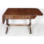 A Regency period mahogany crossbanded and ebony strung Sofa Table, in the manner of George Bulloch,