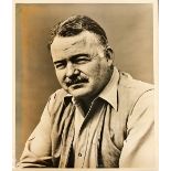[Hemingway (Ernest)] An original sepia Press Photograph of the Author Ernest Hemingway, approx.
