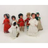 A collection of 7 historical "Crolly Dolls," in various styles, female figures, as a collection.