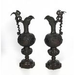 A pair of tall 19th Century heavy bronze Claret Jugs, after the Antique, with dragon handles,