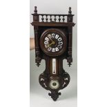 A shaped walnut Wall Clock, of small proportions with barometer and thermometer.