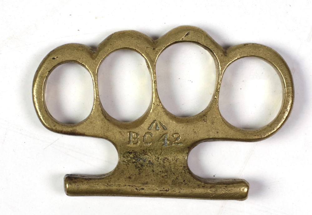 A Victorian period brass Knuckle Duster, with mark BC42.