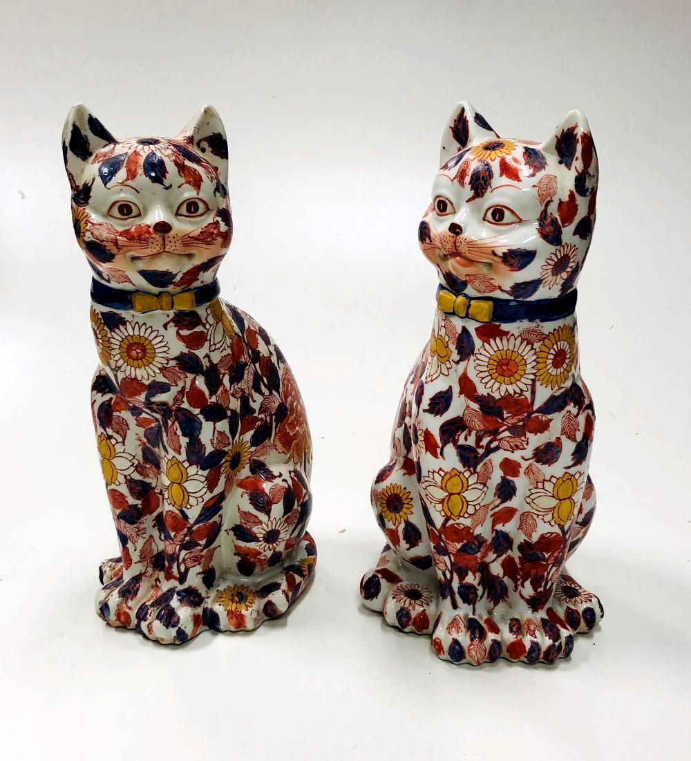 A pair of attractive late 19th Century / early 20th Century porcelain Cats,