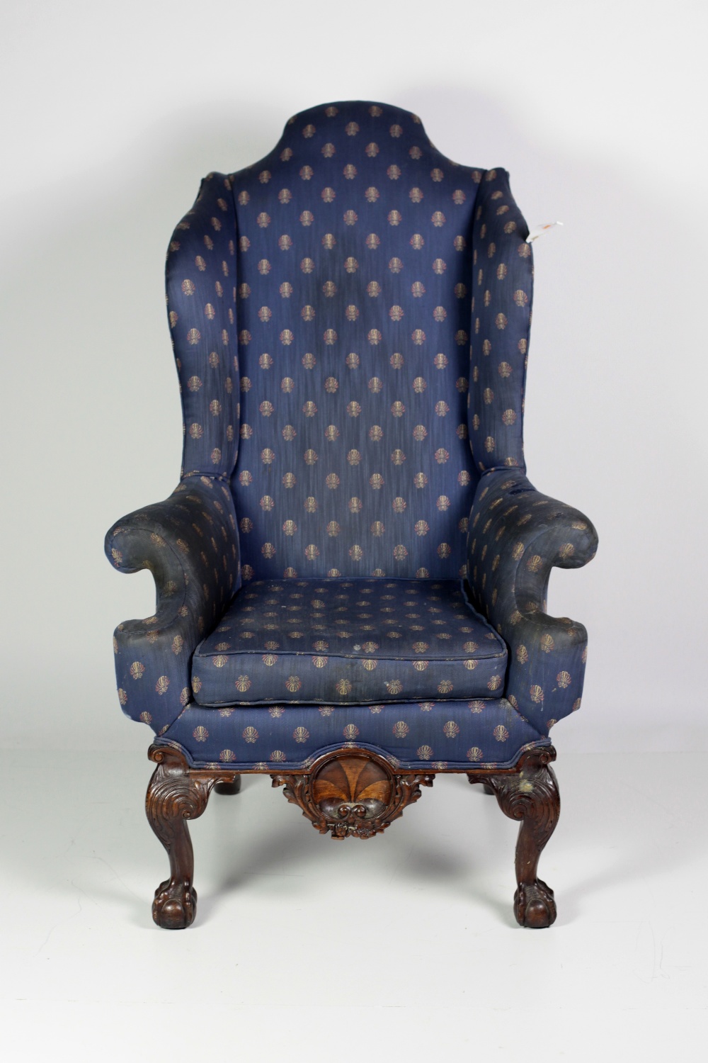 A 19th Century carved mahogany framed blue upholstered high back Wing Armchair,