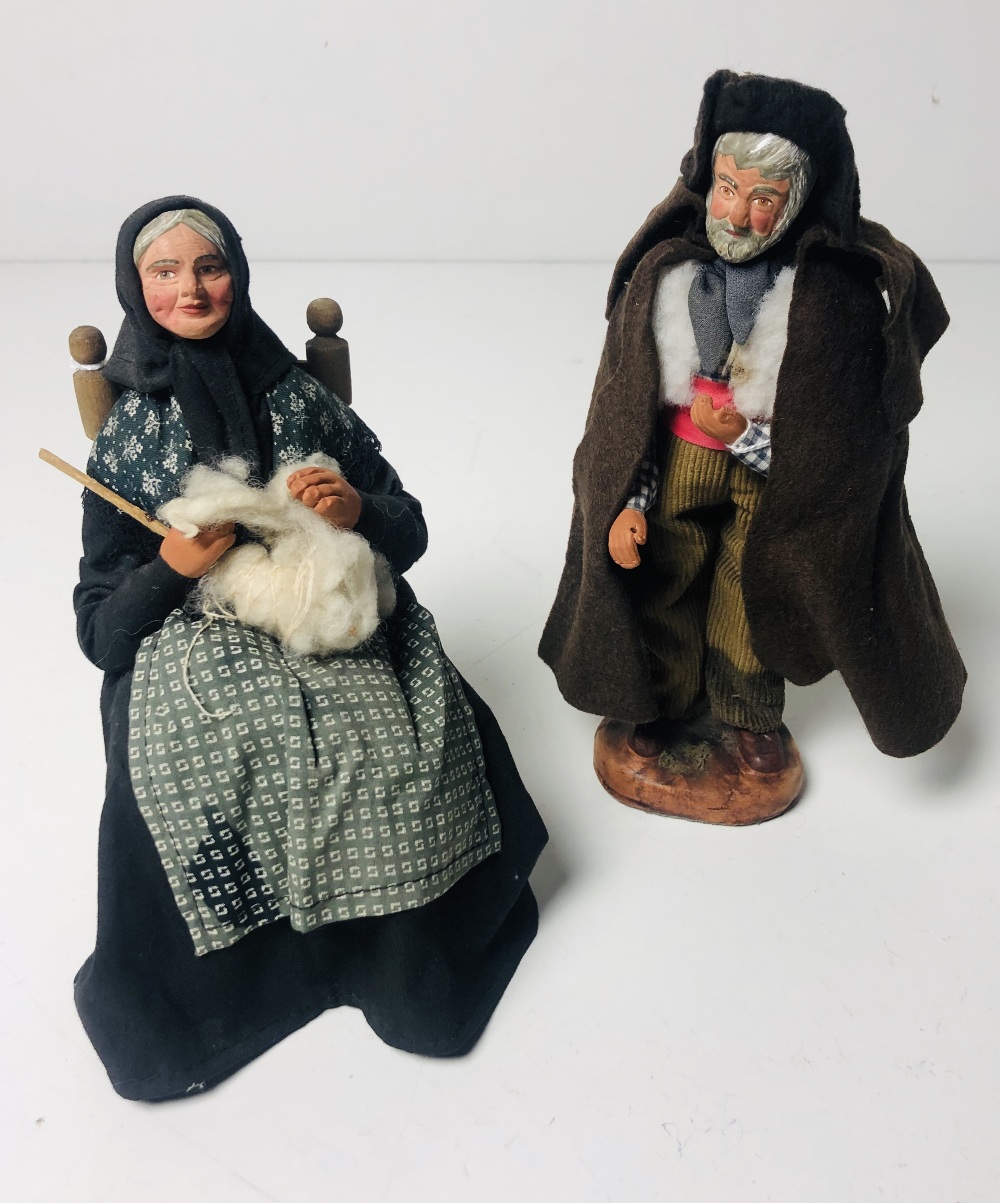 Two unusual Clay Figures, of a seated elderly Lady knitting,