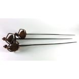 A rare matching set of 3, late 17th Century / early 18th basket hilted Cavalry Backswords,
