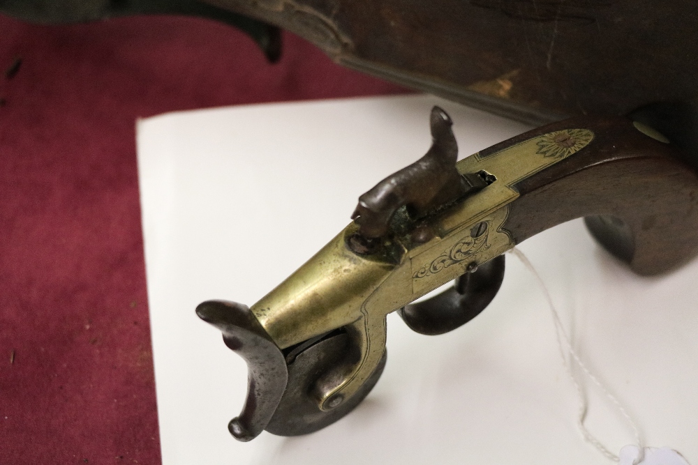 An antique flintlock tinder box Gun, with engraved brass stock and wooden handle. - Image 11 of 12