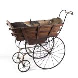 A late 18th Century / early 19th Century Child's Pushchair, with latted wooden frame,