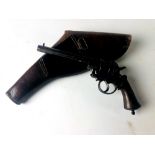 A 19th Century American Revolver, with wooden handle and six shot chamber, and leather holster.
