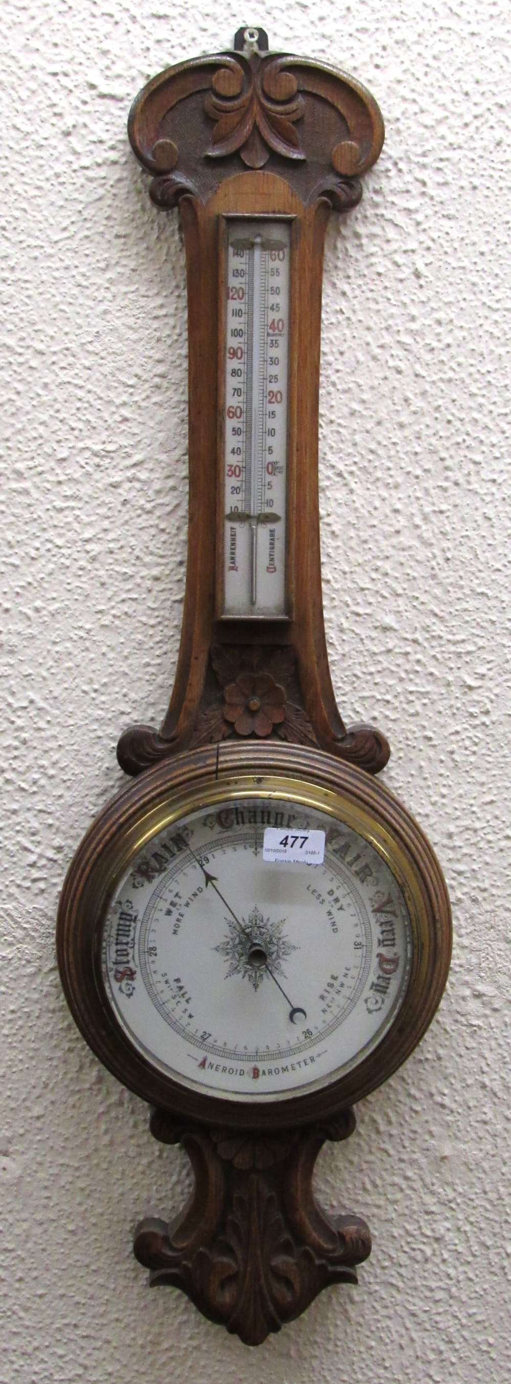 A 19th Century carved oak Aneroid Barometer.