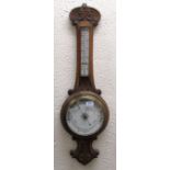 A 19th Century carved oak Aneroid Barometer.