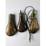 Three antique copper Powder Flasks, two plain and one engraved.
