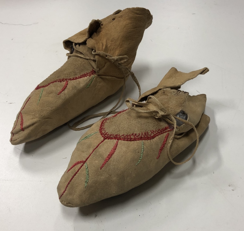 Tribal Art: A rare pair of 19th Century Native American hide Moccasins,