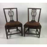 A pair of Irish Georgian mahogany pierced back Side Chairs, with upholstered seats,