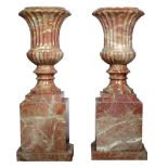 A pair of attractive large Sienna marble Urns, on stands,
