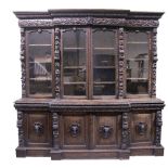 A good 19th Century profusely carved oak Breakfront Bookcase,