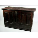 A late 18th Century / early 19th Century stained oak lift top Coffer,