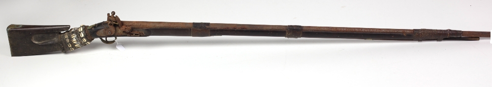 An early Victorian Colonial long barrel flintlock Rifle, with leather banding, shell decoration,