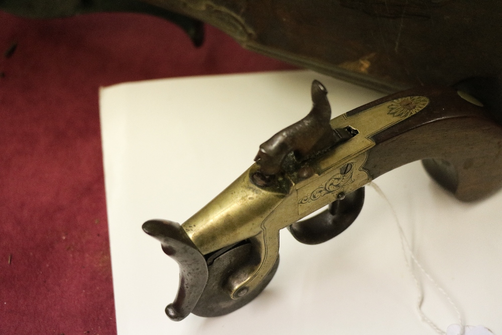 An antique flintlock tinder box Gun, with engraved brass stock and wooden handle. - Image 12 of 12