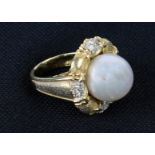 An unusual 18ct gold Ring (size M, approx. 16.6 gms) set with 12 diamonds (.18ct t.c.w.
