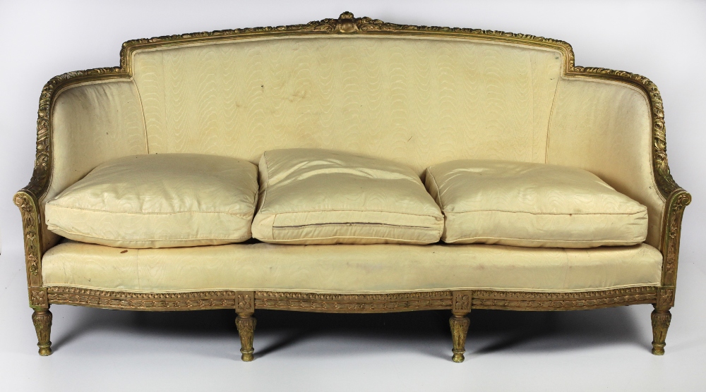 A 19th Century French style carved giltwood Settee, decorative rim covered in yellow silk fabric,