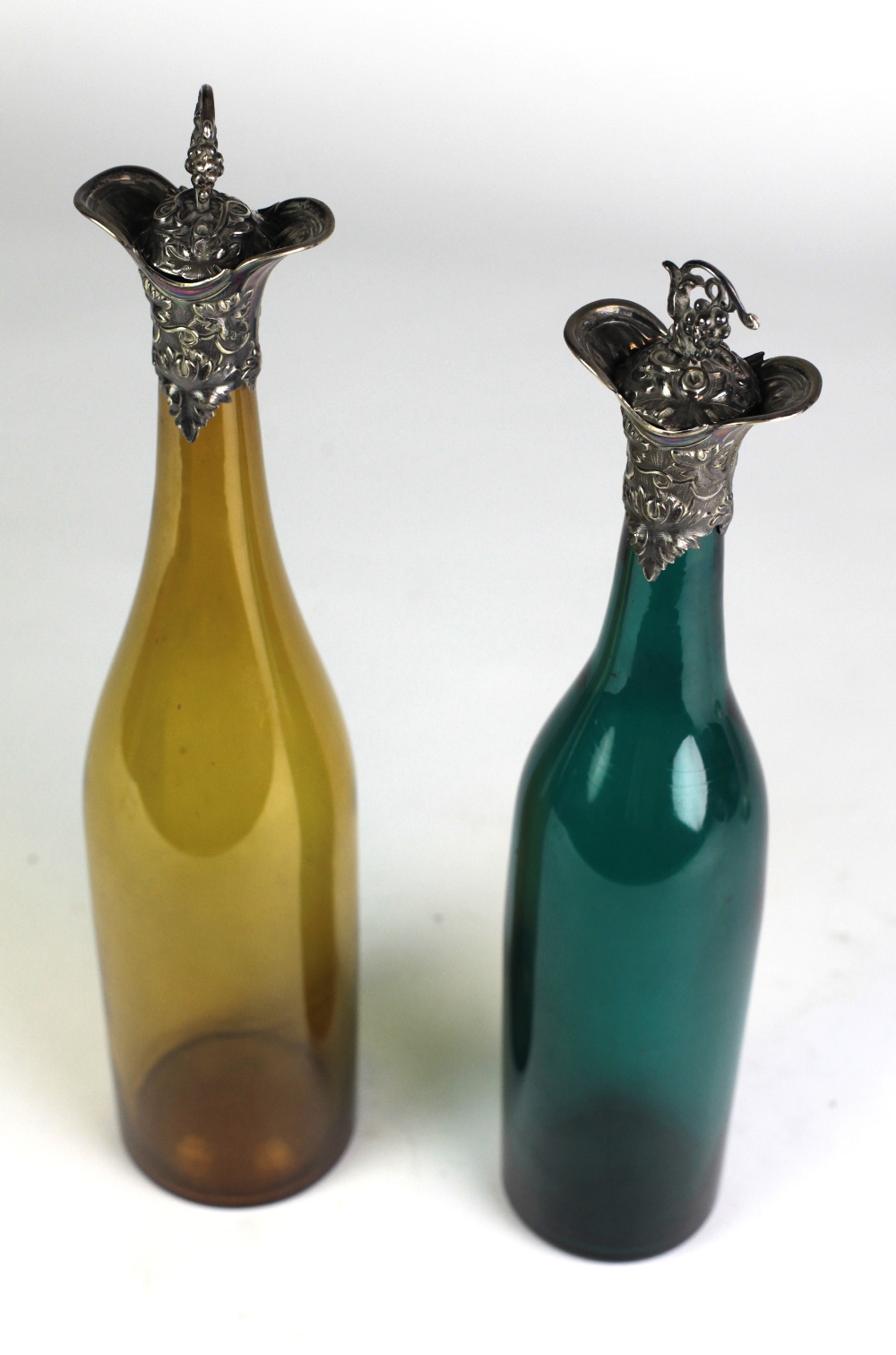 An attractive pair of very early Victorian silver mounted tall orange and green glass Wine