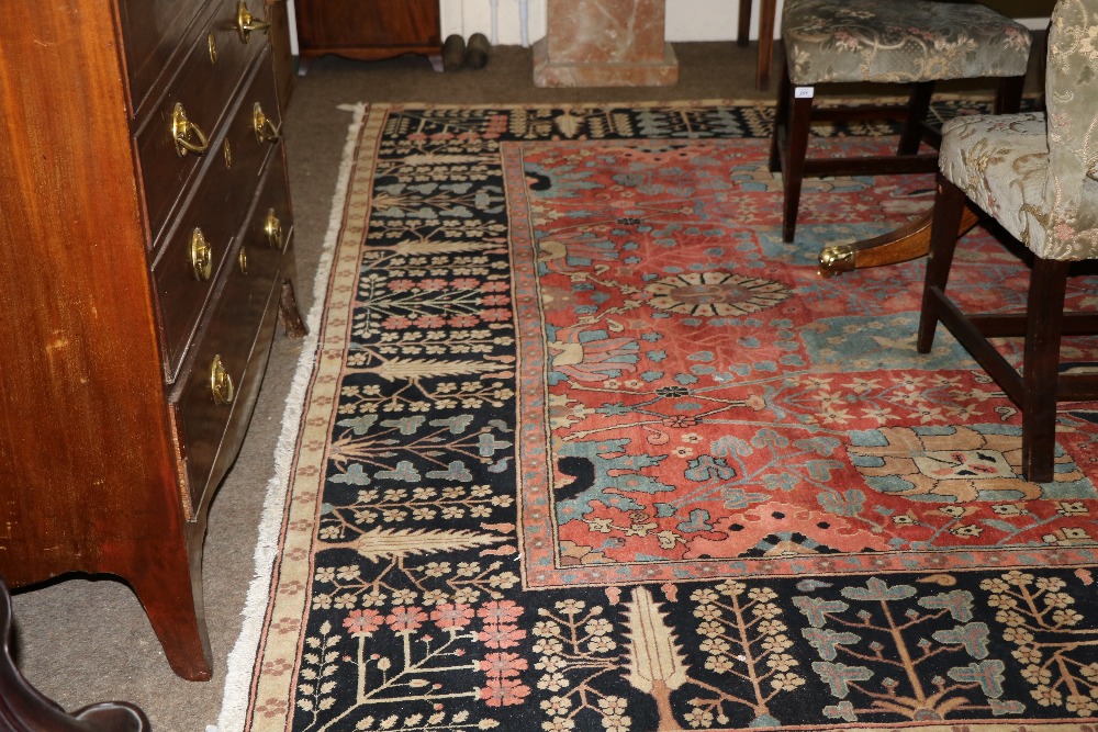 A fine quality Persian 20th Century claret ground Carpet, with a large floral decorated centre, - Image 4 of 4