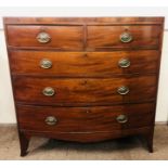 A Georgian period bow fronted Chest of two short and three long drawers with ebony string inlay