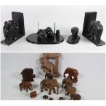 A pair of carved ebony Elephant Book Rests, an ebony Elephant Desk Companion,