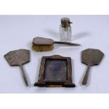 Two Birmingham silver Hand Mirrors, with machine turned decoration, a similar silver hand Brush,