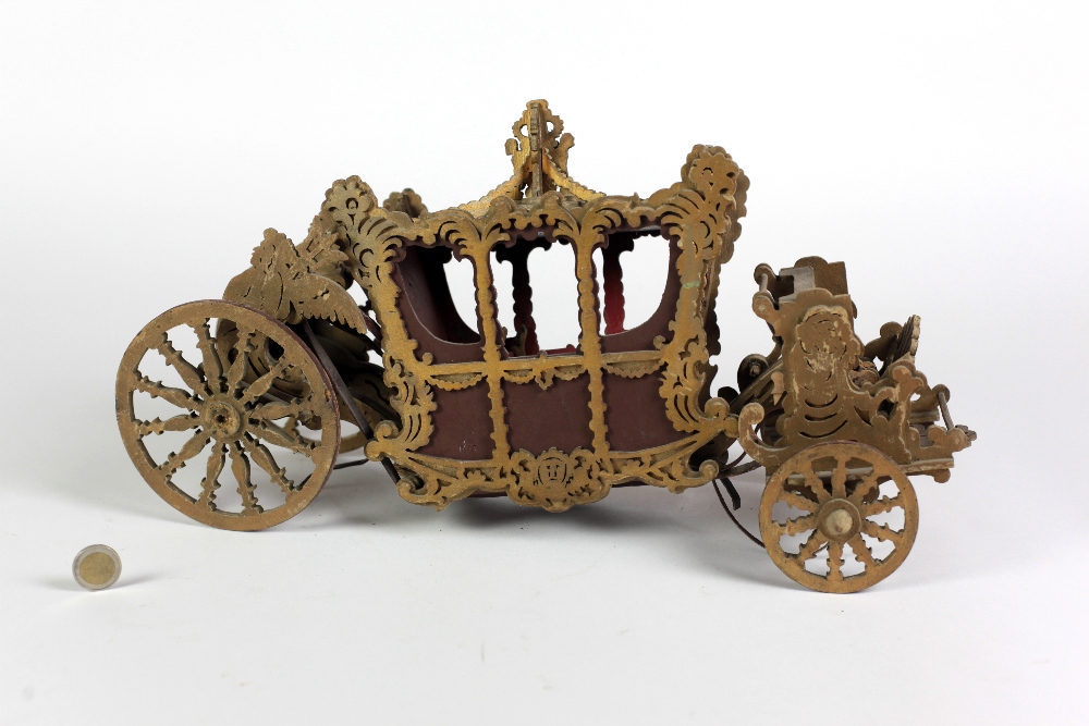 A carved and pierced wooden Model of the Dublin Lord Mayor Horse Drawn Carriage, with ornate design.