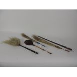 Three Oriental Fly-Swats, a Continental ditto with embossed leather top,
