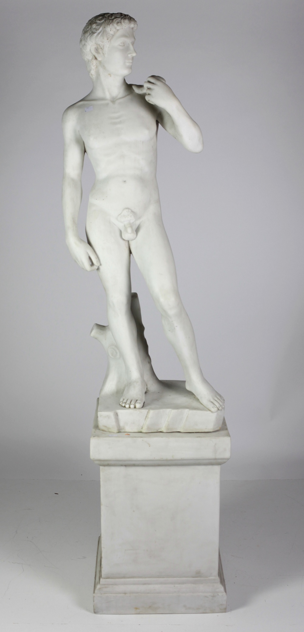 An assimilated marble Model, after the antique of Michelangelo of "David" on pedestal base, approx.