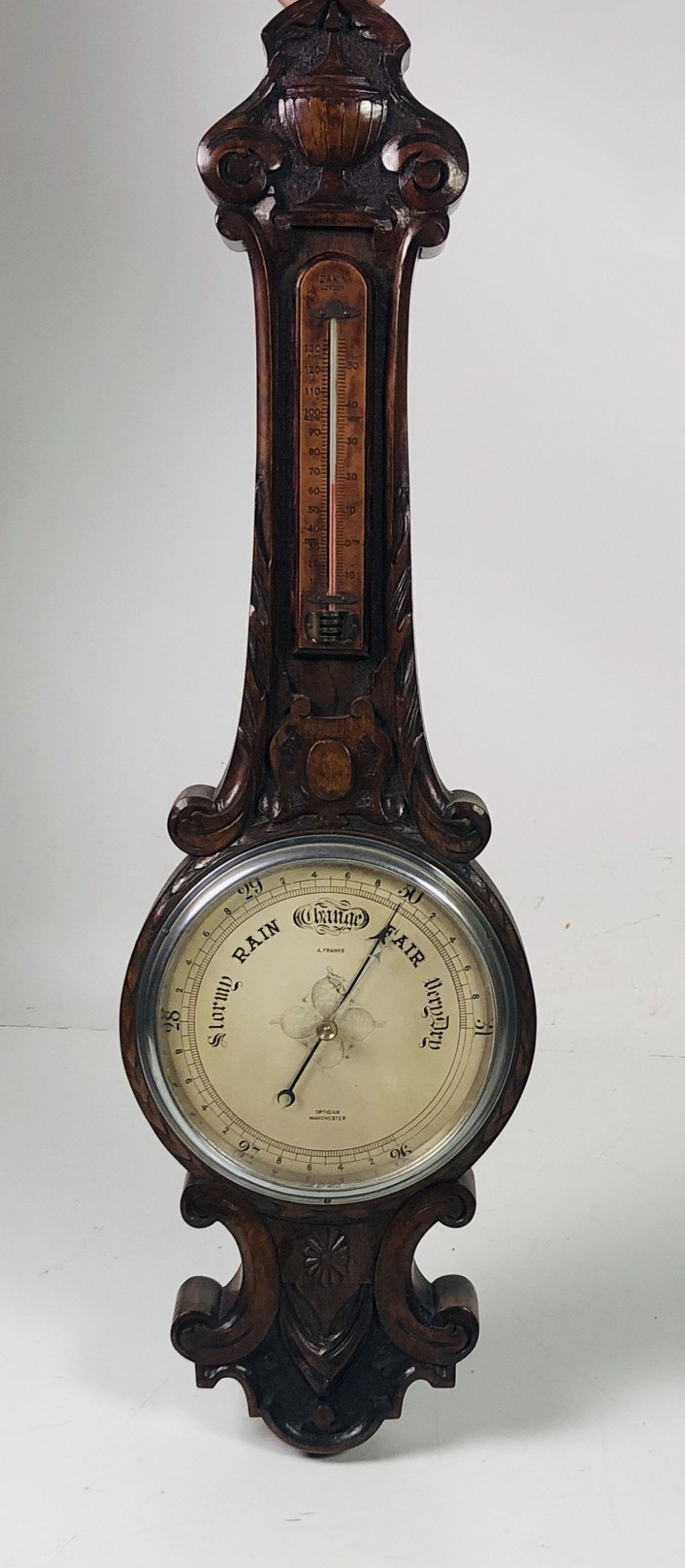 A carved oak Banjo Barometer / Thermometer, signed A. Franks.