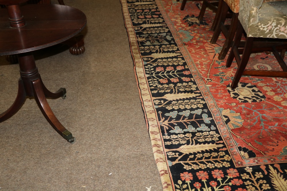 A fine quality Persian 20th Century claret ground Carpet, with a large floral decorated centre, - Image 3 of 4