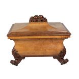 A fine quality George IV mahogany carved and decorated sarcophagus shaped Cellaret,