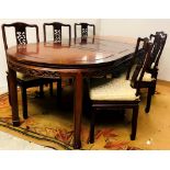 A Chinese carved hardwood extendable Dining Table;