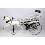 An Edwardian period wicker work and wrought iron framed Child's Horse Tricycle Carriage,
