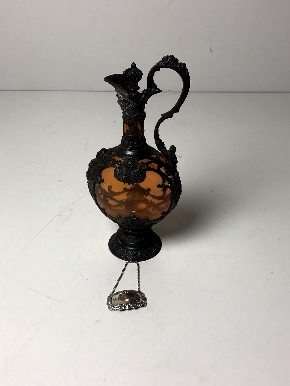 An attractive Victorian period pewter mounted glass Claret Jug and stopper,