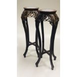 A pair of attractive and tall Chinese hardwood Jardiniere Stands,